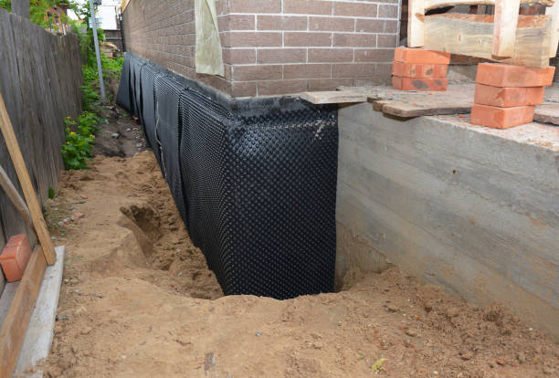 Happy homeowners after waterproofing job in Beaumont